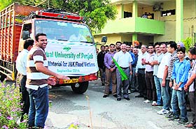 Vice-Chancellor Prof RK Kohli flags off a truck loaded with relief material for Jammu & Kashmir at the CUP.