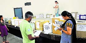 Teachers inspect the boxes of winter uniform of various schools at Girls Government Senior Secondary School, Sector 18, in Chandigarh.
