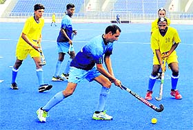 Players in action during a hockey match in Mohali on Saturday. 