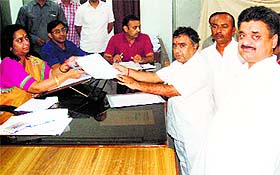 HJC candidate Ravinder Rawal, accompanied by former Deputy CM Chander Mohan (extreme right), files his nomination papers at the SDM office in Panchkula on Saturday.