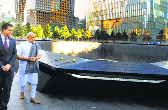 Prime Minister Narendra Modi pays homage to the victims of the 9/11 attack at the National September 11 Memorial & Museum in New York on Saturday.