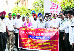 The Indian Doctors for Peace and Development, Ludhiana, flag off a truckload of relief material to Jammu and Kashmir