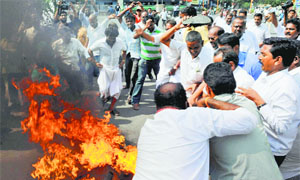 AIADMK members protest in Coimbatore on Saturday after the verdict in Jayalalithaas case.