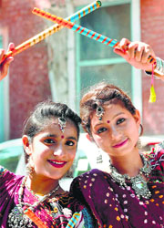 Girls perform Dandiya during Navratri celebrations in Bikaner on Saturday.
