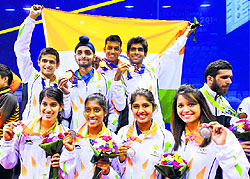 The squash teams, which won a gold and a silver medal