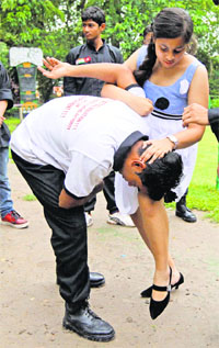 A girl learns self-defence moves