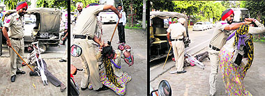 Head constable Gurpreet Singh beats up the handicapped beggar and his wife, holding an infant, while they were asking for alms on the Mall Road on Sunday