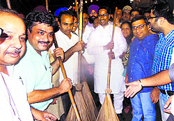 Minister for Local Bodies, Anil Joshi, along with other BJP workers, conducts a cleanliness drive in the holy city under the Swachh Bharat campaign in Amritsar on Sunday