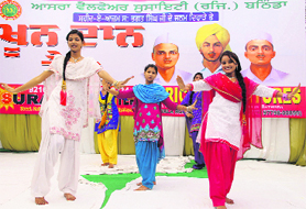 Girls perform a dance to celebrate the birth anniversary of Shaheed Bhagat Singh in Bathinda on Sunday.