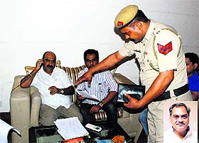 Former HJC leader Shashi Sharma (left) registers a complaint against former HJC leader Venod Sharma (inset) at his residence in Sector 2, Panchkula, on Sunday.