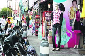 Shopkeepers have extended their shops on the pedestrians way at Ladowali Road market preventing them from walking in Jalandhar