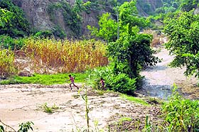 Fields in Khanna-Chhurgal village on the outskirts of Jammu are filled with silt and sand after the devastating floods struck the state.