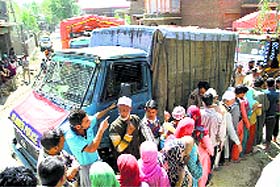 JKAP personnel distribute relief material among flood victims of Kashmir