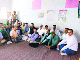 Dhanaulti MLA Mahavir Singh Rangad (in black waistcoat) with BJP workers in Tehri on Sunday. 