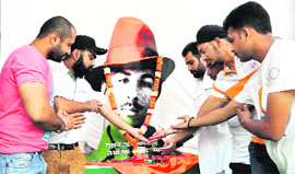 Members of the Shaheed Bhagat Singh Sena pay tributes to the martyr on his birth anniversary in Dehradun on Sunday.