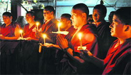 Tibetans take part in a protest march in Dehradun on Saturday to mark the 1987 uprising in Lhasa