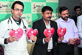 Doctors of Max Super Speciality Hospital unveil a booklet on World Heart Day in Bathinda on Monday.