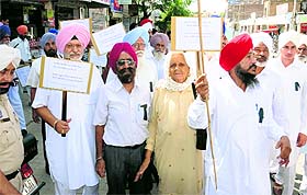 Family members of freedom fighters on their way to the DC office in Bathinda on Monday.