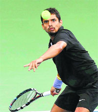 Tennis player Sanam Singh in action during the mens doubles final match at the Asian Games in Incheon on Monday.