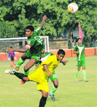 Players of Sahayatri Football Club and Dalbir Football Academy in action during a football match at Sector 17 in Chandigarh on Monday.