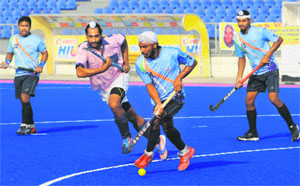 Players vie for the ball during a match between Ropar Hawks Club and ITBP of the 44th SN Vohra All-India Gurmit Singh Memorial Hockey Championship in Mohali.
