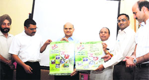Adviser to the UT Administrator KK Sharma (3rd from left) and Mayor HC Kalyan (4th from left) release a poster at Government Model Senior Secondary School, Sector 33, Chandigarh, on Monday.