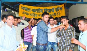 ABVP activists break their fast at Vallabh College in Mandi on Monday
