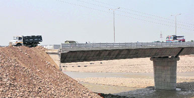 Vehicles ply on the fourth bridge on the Tawi near Bhagwati Nagar in Jammu on Monday.