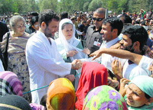 Congress chief Sonia Gandhi and party vice-president Rahul Gandhi interact with flood victims in Anantnag district on Monday
