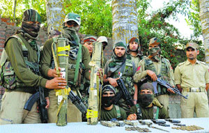 Arms and ammunition recovered from a militant hideout in Kupwara district on Monday.