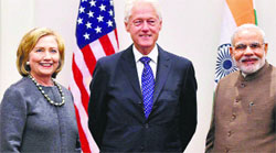 Prime Minister Narendra Modi with former US President Bill Clinton and Hillary Clinton in New York on Monday. PTI