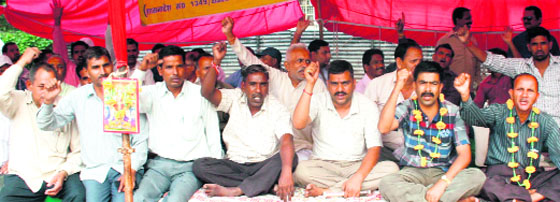 Revenue ameens protest in support of their demands in Dehradun on Monday. A Tribune photograph