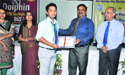A student gets his certificate at the conclusion of the entrepreneurship development programme at Dolphin PG Institute in Dehradun on Monday. A Tribune photograph