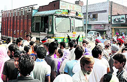 Residents of the Maqboolpura area stage a protest at the Maqboolpura chowk on the main GT road in Amritsar on Tuesday