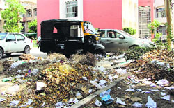 Garbage lying inside the parking zone of the District Administrative Complex (DAC) in Bathinda on Tuesday. Photo: Vijay Kumar