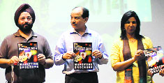 Officials release the marketing brochure of PECFEST14 at the PEC University of Technology in Chandigarh. 