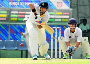 Yuvraj Singh plays a shot during a match between PCC and ONGC at the PCA Stadium in Mohali on Tuesday.