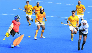 Players in action during a match between the BSF and the Northern Railway in Mohali on Tuesday.