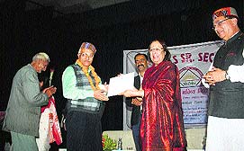 Union Minority Affairs Minister Najma Heptulla launches a provident fund facility for pensioners at Portmore Girls Senior Secondary School in Shimla on Tuesday. 