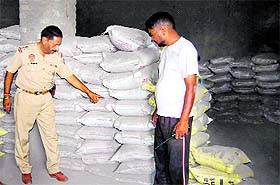 The police with the seized bags of spurious cement in Jalandhar on Tuesday. 