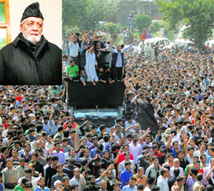 The funeral procession of Moulvi Iftikhar Hussain Ansari (inset) in Srinagar on Tuesday.