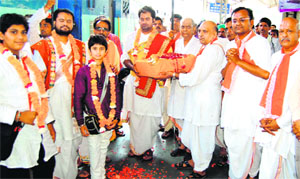 Pilgirms from Gujarat belonging to the Vaishnav sect on their way to the Char Dham pilgrimage being welcomed in Haridwar on Tuesday