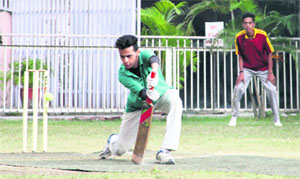 A batsman of The Asian School team plays a shot during a match in the 7th Rohitash Singh Memorial Inter-School Boys Super-8 Cricket Tournament at The Heritage School in Dehradun on Tuesday.