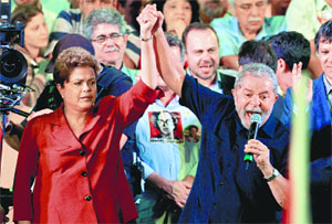 Brazilian President and presidential candidate for the Workers Party Dilma Rousseff (L) with former President Luiz Inacio Lula da Silva during a rally in Sao Paulo
