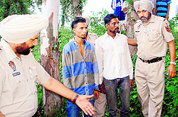 Police officials along with the accused while exhuming the body of Bhajan Singh at Verka in Amritsar on Wednesday