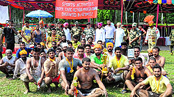 BSF officials with the team, which won kabaddi match for youth of border villages at Dug Toot on Wednesday