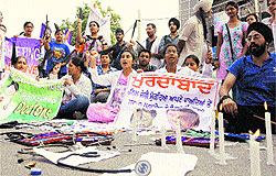 Students of Chintpurni Medical College light candles in protest near Punjab Medical Education Minister Anil Joshis residence in Amritsar on Wednesday