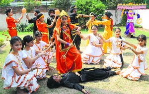 Students of CRB Public School take part in the Durga Puja celebrations on their campus in Sector 7, Chandigarh, on Wednesday.