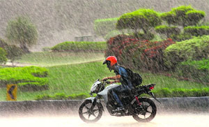 A biker caught unawares by sudden showers in Chandigarh on Wednesday