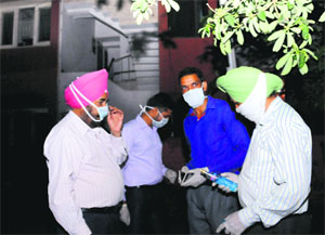 Forensic experts outside the house in Sector 44 in Chandigarh on Wednesday.